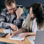 Free couple calculating al their bills stock photo